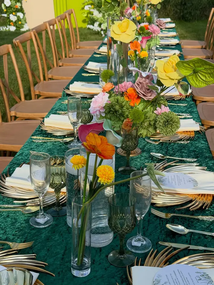 Green and gold outdoor dinner setup